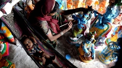 Tamil Nadu and Kerala: In the southern states, Janmashtami is celebrated as ‘Gokulashtami.’ Devotees prepare a variety of sweets and savories like 'seedai' and ‘murukku.’ They create small footprints with rice flour leading to the puja room, symbolizing Lord Krishna's childhood adventures. (Arun Sankar / AFP) Tamil Nadu and Kerala: In the southern states, Janmashtami is celebrated as ‘Gokulashtami.’ Devotees prepare a variety of sweets and savories like 'seedai' and ‘murukku.’ They create small footprints with rice flour leading to the puja room, symbolizing Lord Krishna's childhood adventures. (Arun Sankar / AFP)