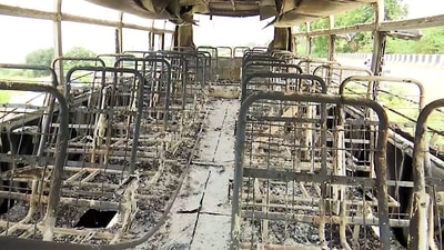 Charred remains of a bus after a protest demanding Maratha Reservation, in Jalna on Saturday. (ANI) Charred remains of a bus after a protest demanding Maratha Reservation, in Jalna on Saturday. (ANI)