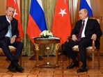 Russian President Vladimir Putin, right, speaks to Turkish President Recep Tayyip Erdogan during their meeting.