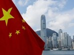 The Chinese national flag is seen in front of the financial district Central on the Chinese National Day in Hong Kong, China.
