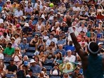 Attendees watch as USA's Frances Tiafoe serves to Australia's Rinky Hijikata during the US Open tennis tournament men's singles round of 16 match at the USTA Billie Jean King National Tennis Center