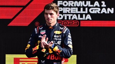 Red Bull Racing's Dutch driver Max Verstappen celebrates on the podium (AFP)