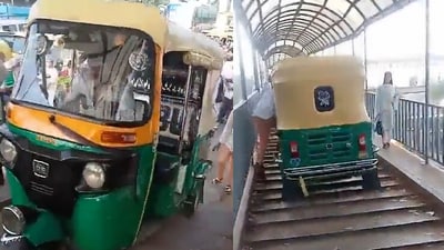 Snapshot of the auto driver riding the vehicle on foot over bridge. (Twitter/@RamrajC93952644)