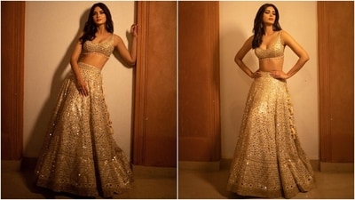 Diana Penty shared pictures of her traditional look on Instagram with the caption, "Saawariya [white and brown heart emojis] In this beautiful creation by @gopivaiddesigns for #WeddingDiariesByHilton. Can't get enough of it [heart eye emoticon]." The post shows her striking elegant poses while showing off the golden lehenga set.&nbsp; (Instagram)