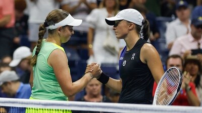 Jelena Ostapenko of Latvia embraces Iga Swiatek of Poland following their Women's Singles Fourth Round match on Day Seven of the 2023 US Open (AFP) Jelena Ostapenko of Latvia embraces Iga Swiatek of Poland following their Women's Singles Fourth Round match on Day Seven of the 2023 US Open (AFP)