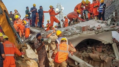 According to the police, three people are trapped under the rubble. National Disaster Response Force (NDRF) and State Disaster Response Force teams are trying to rescue them, they added. (PTI) According to the police, three people are trapped under the rubble. National Disaster Response Force (NDRF) and State Disaster Response Force teams are trying to rescue them, they added. (PTI)