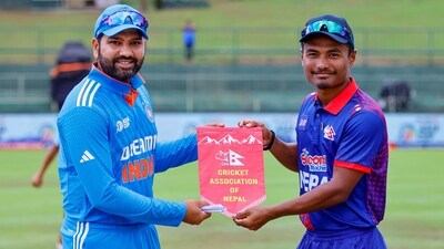 Indian captain Rohit Sharma and Nepal's captain Rohit Kumar Paudel at the toss (PTI) Indian captain Rohit Sharma and Nepal's captain Rohit Kumar Paudel at the toss (PTI)