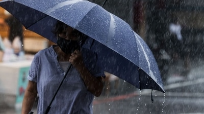 Typhoon Haikui: A woman walks with an umbrella during heavy rain near Su-ao port in Yilan as Typhoon Haikui makes landfall in eastern Taiwan. (AFP) Typhoon Haikui: A woman walks with an umbrella during heavy rain near Su-ao port in Yilan as Typhoon Haikui makes landfall in eastern Taiwan. (AFP)