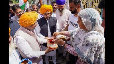 Union minister Anurag Thakur during the collection of country's soil as part of BJP's 'Kalash Yatra' remembering the unsung heroes and martyrs of the freedom struggle, in Phagwara on Monday. (PTI) Union minister Anurag Thakur during the collection of country's soil as part of BJP's 'Kalash Yatra' remembering the unsung heroes and martyrs of the freedom struggle, in Phagwara on Monday. (PTI)