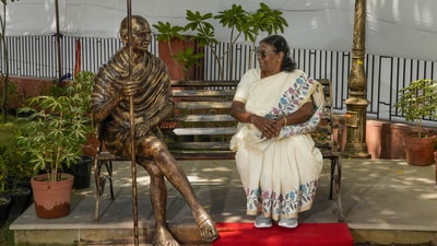 President poses for a picture along with a statue of Mahatma Gandhi. At the Gandhi Vatika, Murmu inaugurated different statues of the father of our nation. Taking to X, she wrote, “Today, it gives me great pleasure to participate in the unveiling of the statue of the Father of the Nation Mahatma Gandhi sitting in meditation posture and the inauguration ceremony of Gandhi Vatika consisting of his statues in different postures.” (X/ President of India) President poses for a picture along with a statue of Mahatma Gandhi. At the Gandhi Vatika, Murmu inaugurated different statues of the father of our nation. Taking to X, she wrote, “Today, it gives me great pleasure to participate in the unveiling of the statue of the Father of the Nation Mahatma Gandhi sitting in meditation posture and the inauguration ceremony of Gandhi Vatika consisting of his statues in different postures.” (X/ President of India)