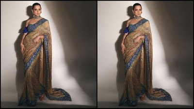 Kangana played muse to fashion designer Suneet Varma and donned a mesmerising printed saree with heavily embellished borders. She paired it with a stunning sleeveless blue blouse for a glam look. (Instagram/@kanganaranaut) Kangana played muse to fashion designer Suneet Varma and donned a mesmerising printed saree with heavily embellished borders. She paired it with a stunning sleeveless blue blouse for a glam look. (Instagram/@kanganaranaut)