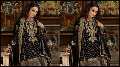 Kangana wore an exquisite black suit by Heena Kochhar worth <span class='webrupee'>₹</span>61k. It features a printed benarsi kurta with gold zari work, full sleeves and a V-neckline. She paired it with a matching silk salwar and organza duppata with gold embroidered heavy borders. (Instagram/@kanganaranaut) Kangana wore an exquisite black suit by Heena Kochhar worth <span class='webrupee'>₹</span>61k. It features a printed benarsi kurta with gold zari work, full sleeves and a V-neckline. She paired it with a matching silk salwar and organza duppata with gold embroidered heavy borders. (Instagram/@kanganaranaut)