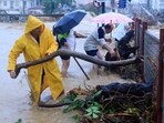 Residents remove debris from a flooded area in the town of Volos, central Greece, Tuesday. Residents remove debris from a flooded area in the town of Volos, central Greece, Tuesday.