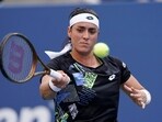 Ons Jabeur, of Tunisia, returns a shot to Qinwen Zheng, of China, during the fourth round of the U.S. Open