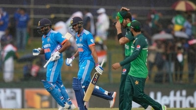 India's Rohit Sharma, left, and Shubman Gill run back to pavilion as it rains during the Asia Cup cricket match between India and Pakistan in Pallekele, (AP)