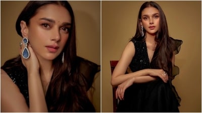 Aditi accessorised the ensemble with statement dangling earrings and a matching ring. Lastly, she chose winged eyeliner, mascara on the lashes, feathered brows, a bindi, mauve lip shade, subtle eye shadow, blushed cheeks, beaming highlighter, and centre-pated open locks for the glam picks. (Instagram) Aditi accessorised the ensemble with statement dangling earrings and a matching ring. Lastly, she chose winged eyeliner, mascara on the lashes, feathered brows, a bindi, mauve lip shade, subtle eye shadow, blushed cheeks, beaming highlighter, and centre-pated open locks for the glam picks. (Instagram)