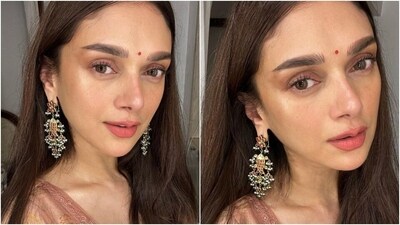 For the glam picks, Aditi chose darkened brows, a red bindi, mascara on the lashes, subtle eye shadow, blush-tinted cheeks, matte mauve lip shade, and glowing skin. A centre-parted open hairdo gave the finishing touch to her ensemble. (Instagram) For the glam picks, Aditi chose darkened brows, a red bindi, mascara on the lashes, subtle eye shadow, blush-tinted cheeks, matte mauve lip shade, and glowing skin. A centre-parted open hairdo gave the finishing touch to her ensemble. (Instagram)