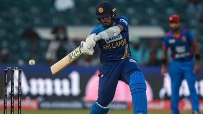Maheesh Theekshana plays a shot during the Asia Cup 2023 match between Sri Lanka and Afghanistan at the Gaddafi Stadium in Lahore (AFP)