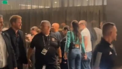 A Twitter video shows Harry glancing over at Brooklyn Beckham and his wife, Nicola Peltz, but walking away quickly with his bodyguards (@footbal_maniacc screenshot/Twitter) A Twitter video shows Harry glancing over at Brooklyn Beckham and his wife, Nicola Peltz, but walking away quickly with his bodyguards (@footbal_maniacc screenshot/Twitter)