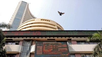 A bird flies past a screen displaying the Sensex results on the facade of the Bombay Stock Exchange (BSE) building in Mumbai. (REUTERS)