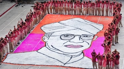 School students pose near a 'rangoli' of former president Sarvepalli Radhakrishnan to commemorate his birth anniversary which is also celebrated as Teachers' Day, in Moradabad. (PTI) School students pose near a 'rangoli' of former president Sarvepalli Radhakrishnan to commemorate his birth anniversary which is also celebrated as Teachers' Day, in Moradabad. (PTI)
