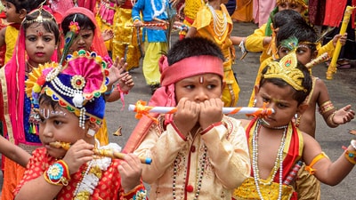 Students dressed as Lord Krishna and Radha pose during Krishna Janmashtami celebrations at Balurghat in South Dinajpur district, West Bengal. (PTI)