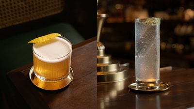 Rear view (left) is a tequila-based cocktail flavoured with aromatic ingredients such as black garlic from Assam, honey, ginger, and lime while Waiting List (right) is a coconut fat-washed, tequila-based cocktail with house-made curry leaf soda and curry leaf salt.
