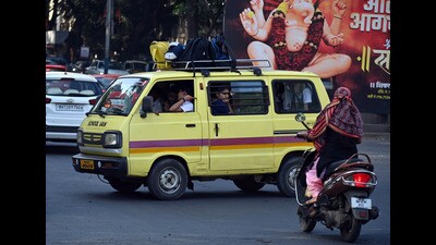 Students in the school van near Dandekar Bridge on Tuesday. (Kalpesh Nukte/HT PHOTO)