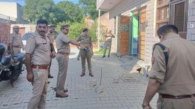 The police at the woman’s residence on Tuesday. The incident took place around 2.30pm in the Brij Vihar colony in Chhapraula village under Badalpur police station limits. (HT Photo) The police at the woman’s residence on Tuesday. The incident took place around 2.30pm in the Brij Vihar colony in Chhapraula village under Badalpur police station limits. (HT Photo)