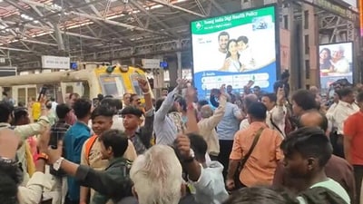 The image shows a group of passengers dancing in a station. (X/@mumbairailusers) The image shows a group of passengers dancing in a station. (X/@mumbairailusers)
