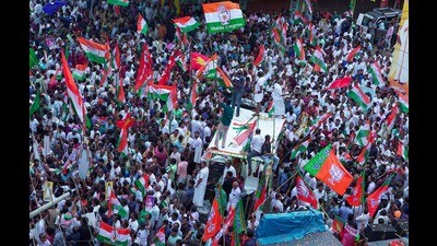 UDF, LDF and BJP workers gather at Pampady junction at the end of the publicity campaign for the Puthupally by-election, in Kottayam on Sep 3. (PTI) UDF, LDF and BJP workers gather at Pampady junction at the end of the publicity campaign for the Puthupally by-election, in Kottayam on Sep 3. (PTI)