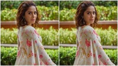 Nushrratt, styled by fashion stylist Nidhi Jeswani, wore her tresses open with a part of her hair in a back brushed look, styled in wavy curls. (Instagram/@nushrrattbharuccha) Nushrratt, styled by fashion stylist Nidhi Jeswani, wore her tresses open with a part of her hair in a back brushed look, styled in wavy curls. (Instagram/@nushrrattbharuccha)