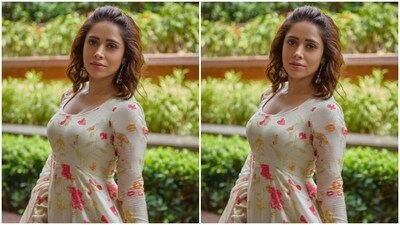 Nushrratt further accessorised her look for the day in statement earrings with green studded stone. (Instagram/@nushrrattbharuccha) Nushrratt further accessorised her look for the day in statement earrings with green studded stone. (Instagram/@nushrrattbharuccha)