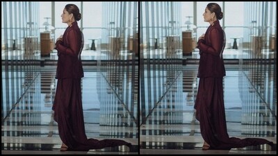 She accessorised her outfit with statement gold earrings and a pair of black stiletto heels. With her hair pulled back in a neat bun and minimal make-up, Kareena completed her glam look. (Instagram/@kareenakapoorkhan) She accessorised her outfit with statement gold earrings and a pair of black stiletto heels. With her hair pulled back in a neat bun and minimal make-up, Kareena completed her glam look. (Instagram/@kareenakapoorkhan)