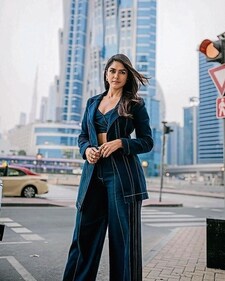 Actor Mrunal Thakur’s version of the Canadian tuxedo features a crop top, a long jacket and pants Actor Mrunal Thakur’s version of the Canadian tuxedo features a crop top, a long jacket and pants