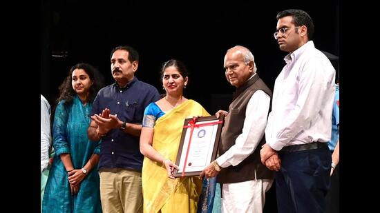 Chandigarh administrator Banwarilal Purohit presenting State Award to a teacher on the occasion of Teachers’ Day at Tagore Theatre in Chandigarh on Tuesday. (Keshav Singh/HT)