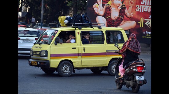 Students in the school van near Dandekar Bridge on Tuesday. (Kalpesh Nukte/HT PHOTO)