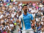 Novak Djokovic, of Serbia, reacts after defeating Taylor Fritz, of the United States, during the quarterfinals of the U.S. Open tennis championships Novak Djokovic, of Serbia, reacts after defeating Taylor Fritz, of the United States, during the quarterfinals of the U.S. Open tennis championships