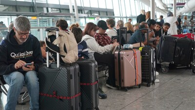 Passengers are seen waiting for delayed flights in London's Heathrow airport. (AP)