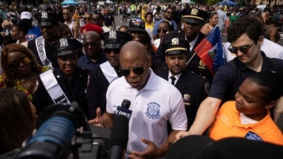 New York City Mayor Eric Adams speaks to media during the West Indian Day Parade, Monday, Sept. 4, 2023, in the Brooklyn borough of New York. The largest U.S. celebration of Caribbean culture is held in New York City, as steel bands, floats and flamboyantly costumed revelers take to the streets in the West Indian Day parade. (AP Photo/Yuki Iwamura) (AP) New York City Mayor Eric Adams speaks to media during the West Indian Day Parade, Monday, Sept. 4, 2023, in the Brooklyn borough of New York. The largest U.S. celebration of Caribbean culture is held in New York City, as steel bands, floats and flamboyantly costumed revelers take to the streets in the West Indian Day parade. (AP Photo/Yuki Iwamura) (AP)
