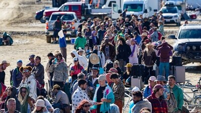 Hundreds of Burning Man attendees who planned to leave on buses wait for information about when they will be able to leave on Labor Day, after a rainstorm turned the site into mud September 4, 2023 (Trevor Hughes / USA TODAY NETWORK via REUTERS) (via REUTERS)