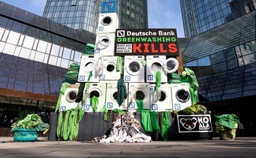 Activists place washing machines in front of the Deutsche Bank headquarters to protest against greenwashing during Deutsche Bank AG Annual Shareholders Meeting in Frankfurt, Germany, in 2022. (Reuters ) Activists place washing machines in front of the Deutsche Bank headquarters to protest against greenwashing during Deutsche Bank AG Annual Shareholders Meeting in Frankfurt, Germany, in 2022. (Reuters )