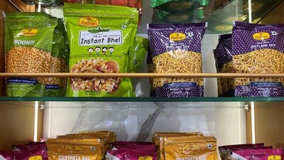 A view shows packets of snacks on the shelves inside a Haldiram's restaurant in Mumbai, India, (REUTERS)