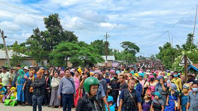 Hundreds of protesters during a protest at Phougakchao Ikhai, in Manipur’s Bishnupur district, Wednesday. (PTI) Hundreds of protesters during a protest at Phougakchao Ikhai, in Manipur’s Bishnupur district, Wednesday. (PTI)