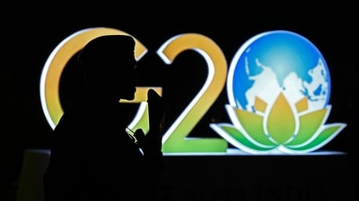 An armed security personnel stands guard near a G20 India summit logo installed along a street in New Delhi on September 6, 2023, ahead of its commencement. (AFP) An armed security personnel stands guard near a G20 India summit logo installed along a street in New Delhi on September 6, 2023, ahead of its commencement. (AFP)