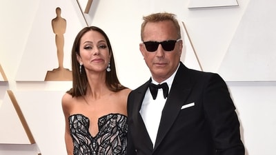 FILE - Christine Baumgartner, left, and Kevin Costner arrive at the Oscars, March 27, 2022, at the Dolby Theatre in Los Angeles. Costner and Baumgartner, his wife of nearly 19 years, are divorcing, a representative for the actor said Tuesday, May 2, 2023. (Jordan Strauss/Invision/AP) FILE - Christine Baumgartner, left, and Kevin Costner arrive at the Oscars, March 27, 2022, at the Dolby Theatre in Los Angeles. Costner and Baumgartner, his wife of nearly 19 years, are divorcing, a representative for the actor said Tuesday, May 2, 2023. (Jordan Strauss/Invision/AP)