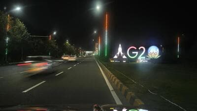 Traffics moves past an illuminated G20 logo near the airport ahead of the G20 Summit in New Delhi. (AP) Traffics moves past an illuminated G20 logo near the airport ahead of the G20 Summit in New Delhi. (AP)