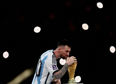 Argentina's Lionel Messi kissing the trophy after winning the World Cup 2022 in Qatar. (REUTERS)