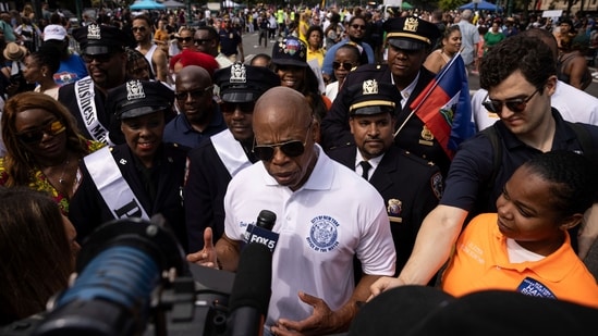 New York City Mayor Eric Adams speaks to media during the West Indian Day Parade, Monday, Sept. 4, 2023, in the Brooklyn borough of New York. The largest U.S. celebration of Caribbean culture is held in New York City, as steel bands, floats and flamboyantly costumed revelers take to the streets in the West Indian Day parade. (AP Photo/Yuki Iwamura) (AP)