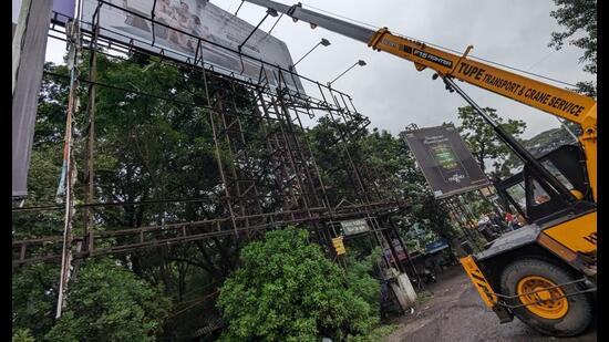 PCB taking action against illegal hoardings (HT PHOTO)